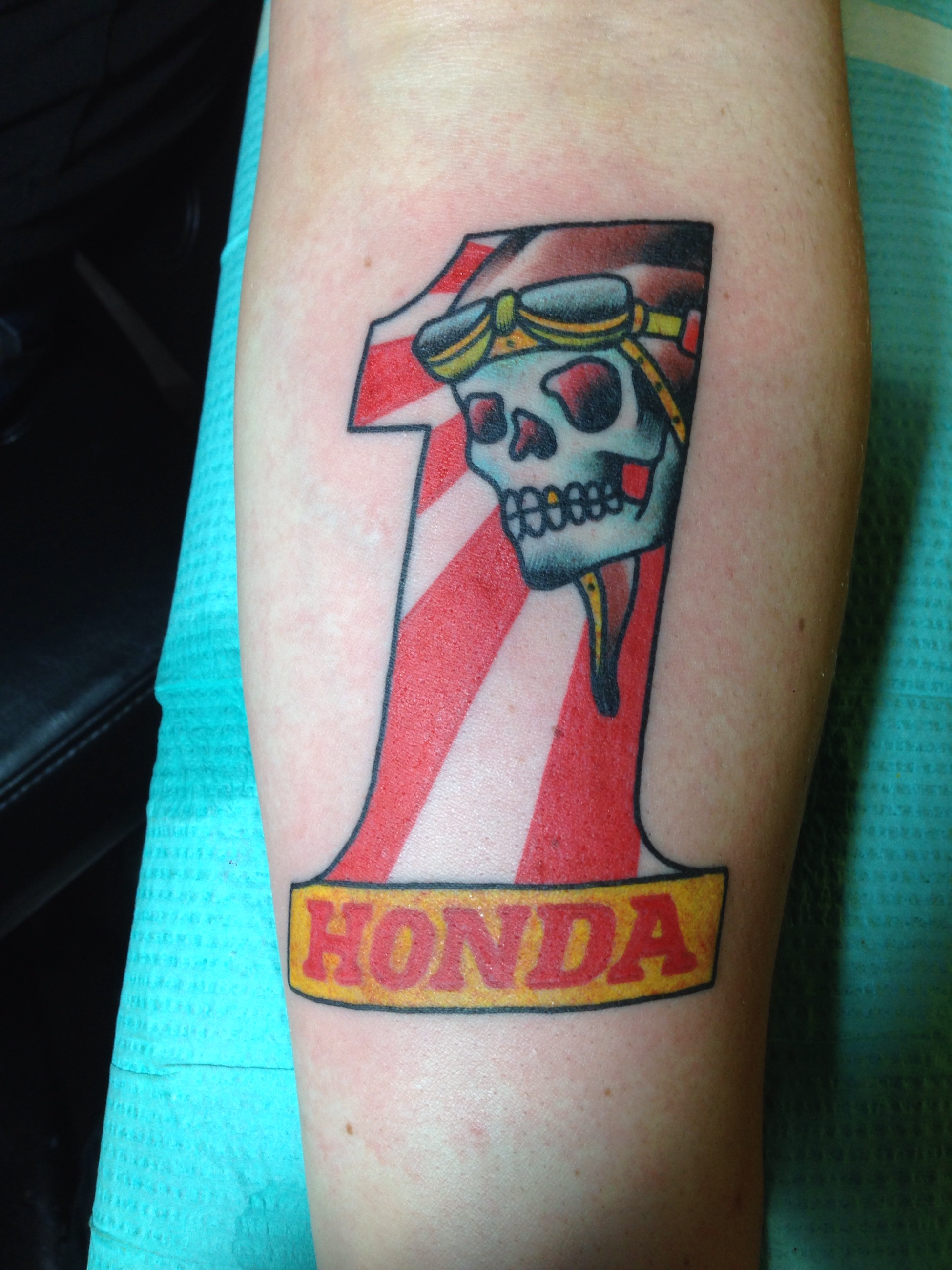 American Traditional Honda 1. Japanese motorcycle pride tattoo on forearm. 